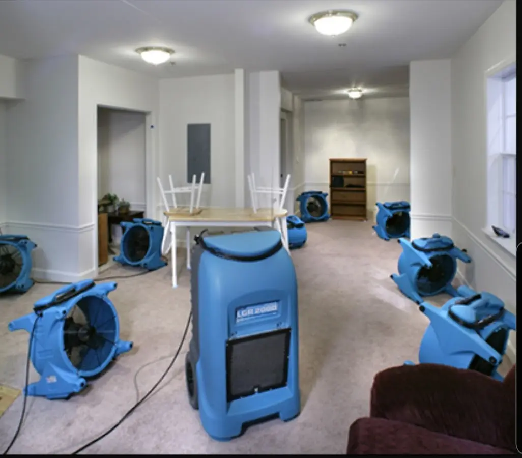Air movers and dehumidifier setup for Water Damage Restoration in Montville